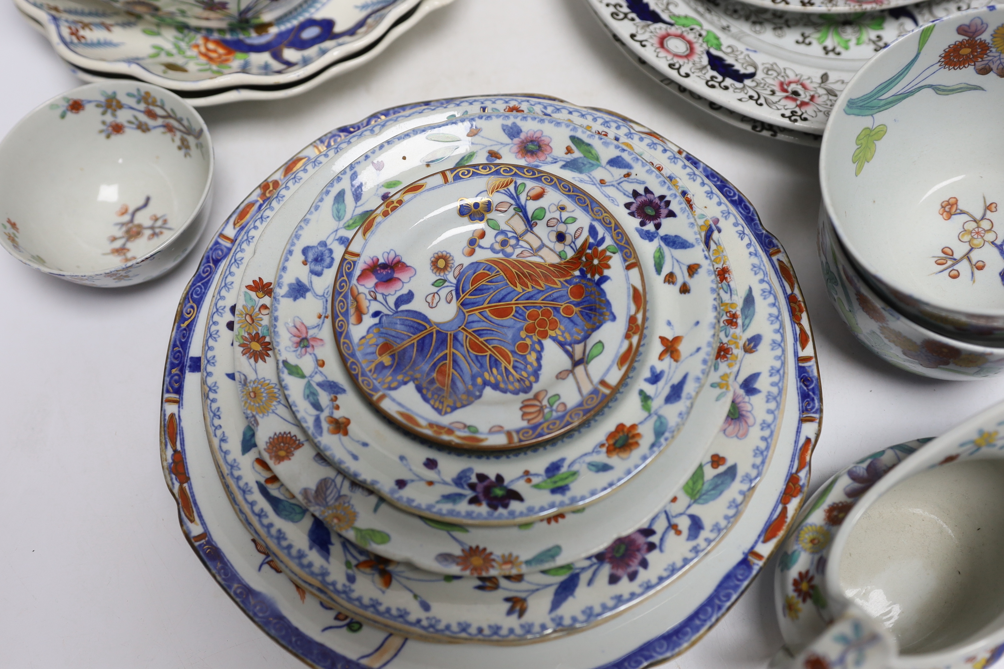 A collection of Spode Ironstone and pottery blue tea and dinnerware, including a pair of oval boat shaped sauce tureens and covers and a pair of shell shaped dessert dishes